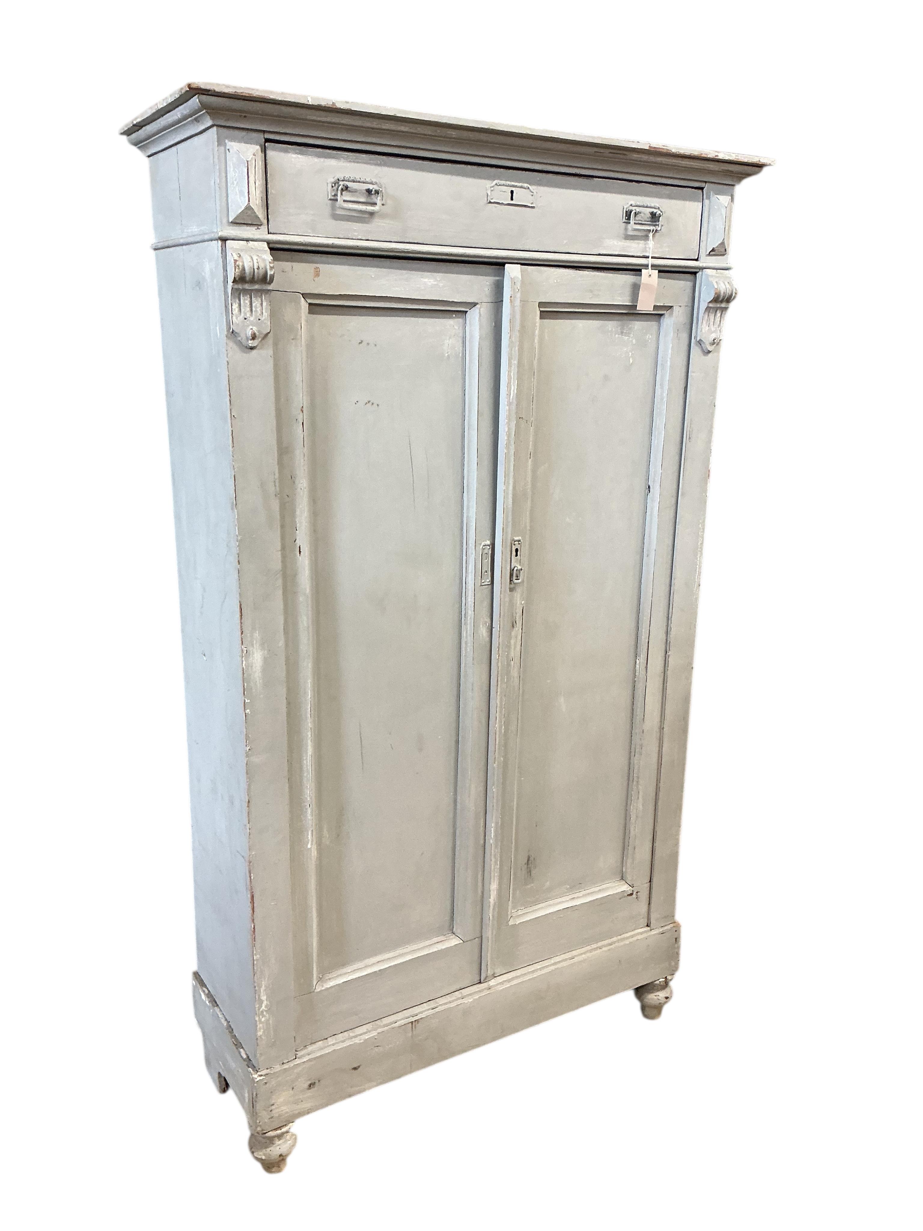 A 19th century Continental painted pine press cupboard, width 110cm, depth 40cm, height 186cm
